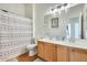 Bathroom with a double sink vanity, shower and bath at 16398 N Oachs Dr, Surprise, AZ 85374