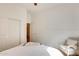 Bedroom features closet, chair and neutral colored walls at 16398 N Oachs Dr, Surprise, AZ 85374
