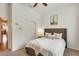 Bedroom features a queen bed, closet, and neutral decor at 16398 N Oachs Dr, Surprise, AZ 85374