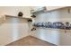 Walk-in closet featuring built-in shelving and carpeted floors, offering ample storage space at 16398 N Oachs Dr, Surprise, AZ 85374