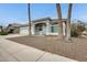 Charming single-story home with a three car garage and desert landscaping at 16398 N Oachs Dr, Surprise, AZ 85374