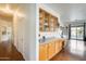 Bright kitchen includes wooden cabinets and countertops with a pool view at 16398 N Oachs Dr, Surprise, AZ 85374