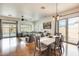 Open floor plan with wood floors connects the living and dining areas at 16398 N Oachs Dr, Surprise, AZ 85374