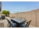 Cozy outdoor patio featuring dining set and grill, ideal for relaxation and entertainment at 16398 N Oachs Dr, Surprise, AZ 85374