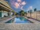 Stunning backyard pool with patio furniture, mature trees and block wall fencing at 16398 N Oachs Dr, Surprise, AZ 85374