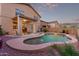 Inviting backyard featuring a pristine pool, covered patio and well-maintained landscaping perfect for relaxation and outdoor enjoyment at 1721 E Cielo Grande Ave, Phoenix, AZ 85024