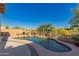 Private backyard oasis with a sparkling pool surrounded by desert landscape and ample space for outdoor activities at 1721 E Cielo Grande Ave, Phoenix, AZ 85024