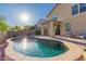 Bright backyard showcasing a stunning pool, covered patio, and neatly landscaped area, ideal for outdoor enjoyment at 1721 E Cielo Grande Ave, Phoenix, AZ 85024