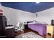 Bedroom with playful ceiling, wood floors, and area rug at 1721 E Cielo Grande Ave, Phoenix, AZ 85024