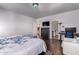 Comfortable bedroom boasts hard wood floors and access to en suite bathroom at 1721 E Cielo Grande Ave, Phoenix, AZ 85024