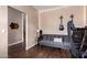 Bonus room featuring a comfortable couch, guitars, and decorative wall art at 1721 E Cielo Grande Ave, Phoenix, AZ 85024
