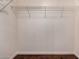 Walk-in closet features a wire shelving unit and wood floors at 1721 E Cielo Grande Ave, Phoenix, AZ 85024