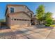 Charming two-story home featuring a well-manicured front yard, two car garage, and inviting front porch at 1721 E Cielo Grande Ave, Phoenix, AZ 85024
