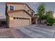 Charming two-story home featuring a well-manicured front yard, two car garage, and inviting front porch at 1721 E Cielo Grande Ave, Phoenix, AZ 85024