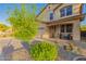 Charming two-story home featuring a well-manicured front yard, two car garage, and inviting front porch at 1721 E Cielo Grande Ave, Phoenix, AZ 85024