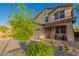Charming two-story home featuring a well-manicured front yard, two car garage, and inviting front porch at 1721 E Cielo Grande Ave, Phoenix, AZ 85024