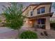 Charming two-story home featuring a well-manicured front yard, two car garage, and inviting front porch at 1721 E Cielo Grande Ave, Phoenix, AZ 85024