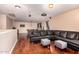 Spacious game room with pool table, sectional sofa, and hardwood flooring at 1721 E Cielo Grande Ave, Phoenix, AZ 85024