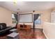 Entertainment area with a large screen projector, comfortable seating, and hardwood flooring at 1721 E Cielo Grande Ave, Phoenix, AZ 85024
