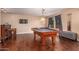 Game room features a pool table, wet bar, dart board, and hardwood flooring at 1721 E Cielo Grande Ave, Phoenix, AZ 85024