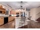Modern kitchen features a center island, stainless steel appliances, and ample counter space at 1721 E Cielo Grande Ave, Phoenix, AZ 85024