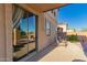 Covered patio offers seamless indoor-outdoor living with sliding glass doors and comfortable seating, perfect for relaxation at 1721 E Cielo Grande Ave, Phoenix, AZ 85024