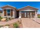 Charming single-story home with well-maintained landscaping and a welcoming front entrance at 17650 W Bajada Rd, Surprise, AZ 85387