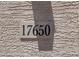 Close-up of a stone displaying the address 17650 on a textured wall at 17650 W Bajada Rd, Surprise, AZ 85387