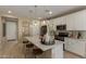 Contemporary kitchen with white cabinets, a large island, and modern stainless steel appliances at 17650 W Bajada Rd, Surprise, AZ 85387