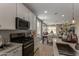 Modern kitchen featuring white cabinetry, stainless steel appliances, and stylish backsplash at 17650 W Bajada Rd, Surprise, AZ 85387