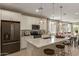 Well-appointed kitchen featuring modern appliances, white cabinets, and a spacious center island at 17650 W Bajada Rd, Surprise, AZ 85387