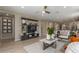 Open-concept living room with sleek decor, ample natural light, and stylish furnishings at 17650 W Bajada Rd, Surprise, AZ 85387