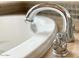 Close-up of a luxurious bathtub with chrome faucet and elegant design at 18507 N 94Th St, Scottsdale, AZ 85255