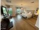 Main bedroom features hardwood floors, a large bed, modern light fixtures, and multiple windows at 18507 N 94Th St, Scottsdale, AZ 85255