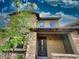 Two-story home with beautiful stone facade, covered porch, and well-maintained landscaping at 18507 N 94Th St, Scottsdale, AZ 85255