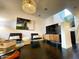 Comfortable living room featuring hardwood floors, a large screen tv, and a modern decor at 18507 N 94Th St, Scottsdale, AZ 85255