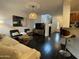 Inviting living room featuring dark wood floors and an open layout at 18507 N 94Th St, Scottsdale, AZ 85255