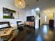 Open living room with dark hardwood floors, comfortable seating, and stairway to the second floor at 18507 N 94Th St, Scottsdale, AZ 85255