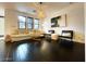 Bright living room with light hardwood floors and an open floor plan at 18507 N 94Th St, Scottsdale, AZ 85255