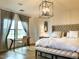 Serene bedroom featuring natural light, light wood floors and a cozy sitting area at 18507 N 94Th St, Scottsdale, AZ 85255