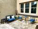 Cozy patio with tile floors, seating, and views of the lush backyard at 18507 N 94Th St, Scottsdale, AZ 85255