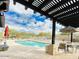 Community pool with lounge seating and pergola, surrounded by desert landscaping at 18507 N 94Th St, Scottsdale, AZ 85255