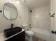 Modern bathroom featuring a sleek black sink, stylish mirror, and tiled shower-tub combination at 1916 W Morningside Dr # 111, Phoenix, AZ 85023