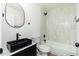 Modern bathroom with tiled shower and unique black fixtures and vessel sink at 1916 W Morningside Dr # 111, Phoenix, AZ 85023