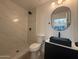 Contemporary bathroom with a glass-enclosed shower, modern fixtures, and a sleek black sink at 1916 W Morningside Dr # 111, Phoenix, AZ 85023