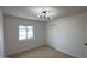 Bedroom with neutral carpet, window view, modern lighting and closet at 1916 W Morningside Dr # 111, Phoenix, AZ 85023