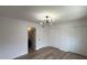 Light-filled bedroom featuring modern lighting, wood-look floors, and closet doors at 1916 W Morningside Dr # 111, Phoenix, AZ 85023