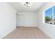 Bedroom featuring cozy carpet, a window with a nice view, and closet space at 1916 W Morningside Dr # 111, Phoenix, AZ 85023