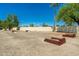 Gravel community lot with wooden beams placed throughout at 1916 W Morningside Dr # 111, Phoenix, AZ 85023