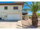 Multi-level home with attached garage and mature palm trees on a gravel lot at 1916 W Morningside Dr # 111, Phoenix, AZ 85023